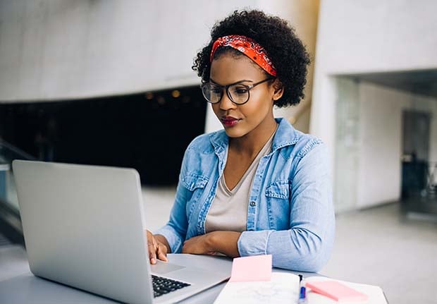 adult female student using laptop